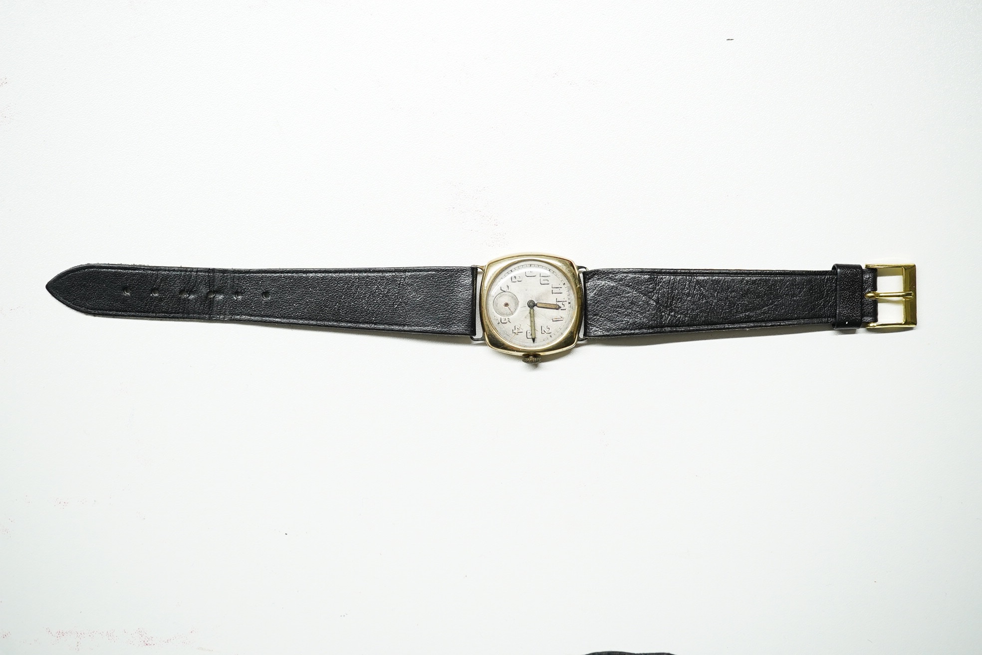 A gentleman's 1920's 14k Longines manual wind wrist watch, with Arabic dial and subsidiary seconds, case diameter 27mm, on associated leather strap, with associated Longines box. Condition - poor